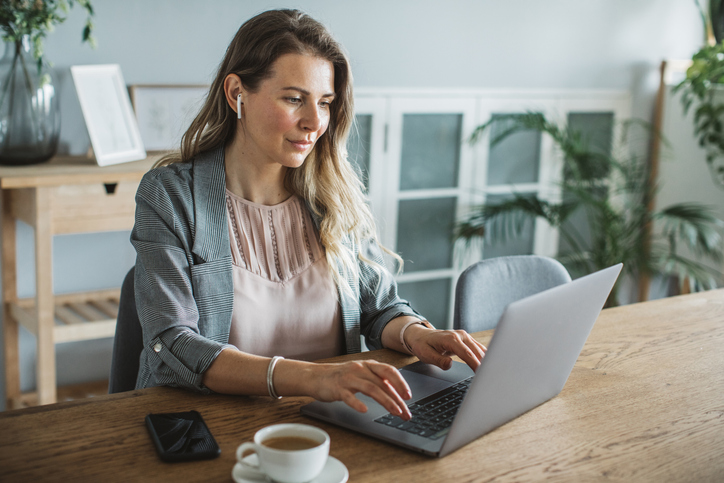 A woman comparing tax requirements for tax-deferred and tax exempt retirement accounts.