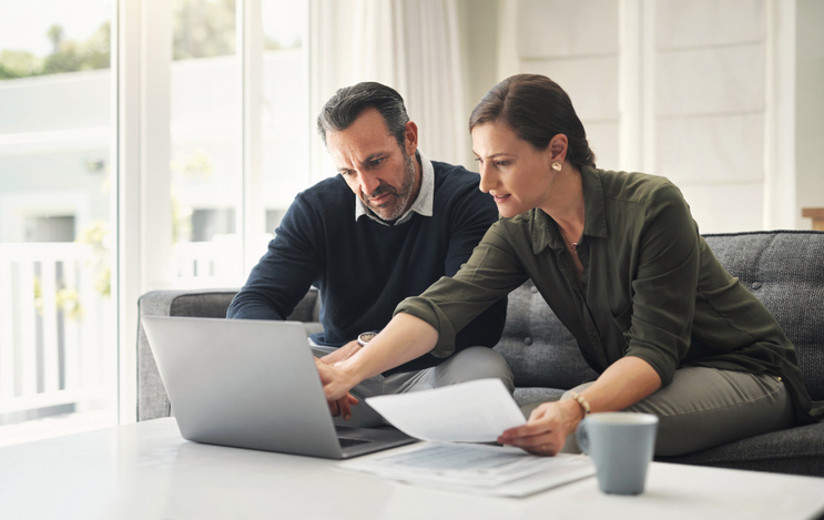 A man meeting with a financial advisor to estimate how much he should have saved by age 60.