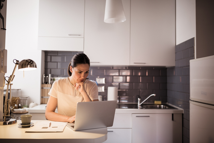 A woman researching how to set up a trusteed IRA.