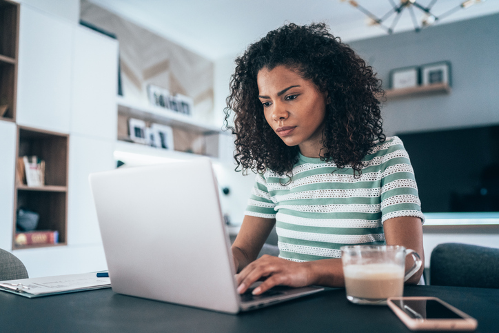 A woman researching different ways to save for retirement.