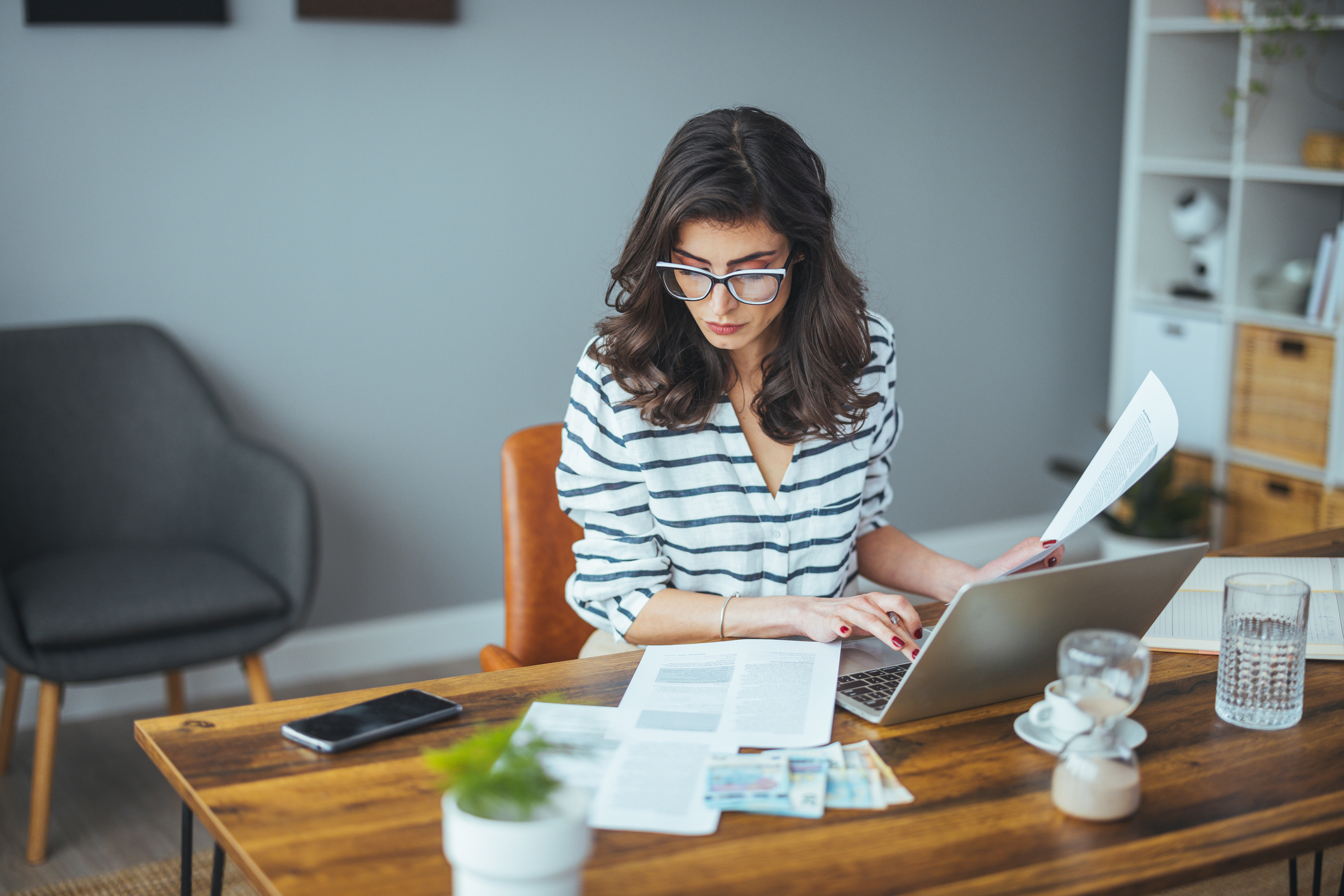 A woman researching how to avoid common tax mistakes.