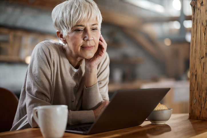 A woman making adjustments to her retirement plan.