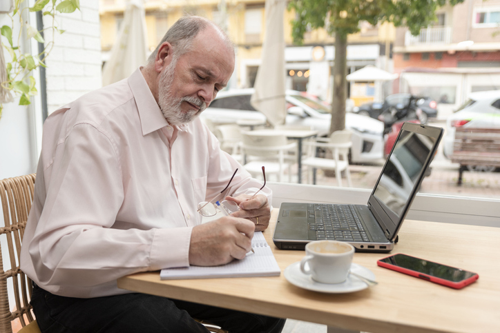 A man researching how he could invest in mutual funds for retirement.