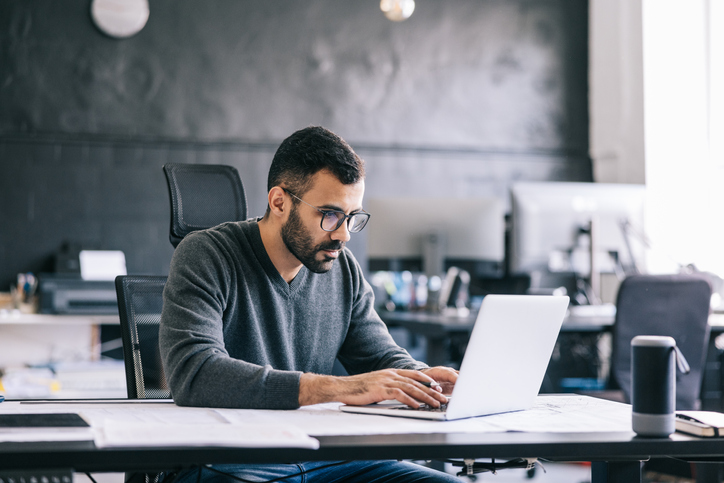 A man researching the requirements to qualify for an IRS exception to make an early IRA withdrawal without penalty.