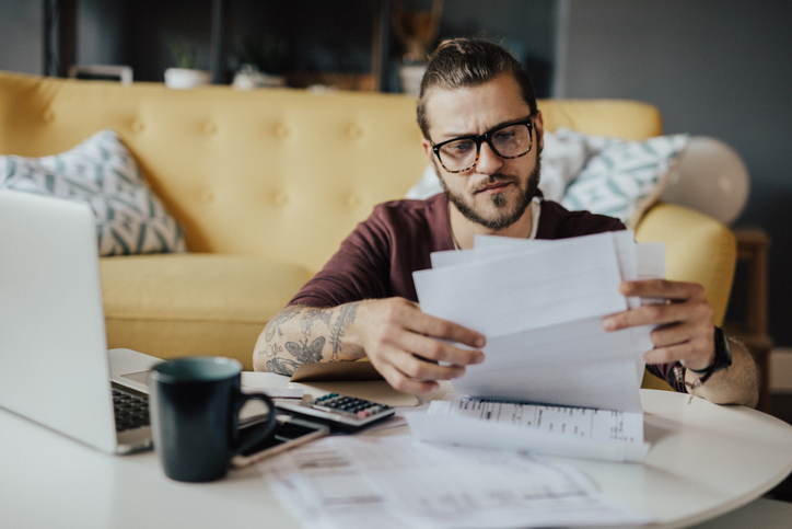 A man estimating his monthly retirement savings.