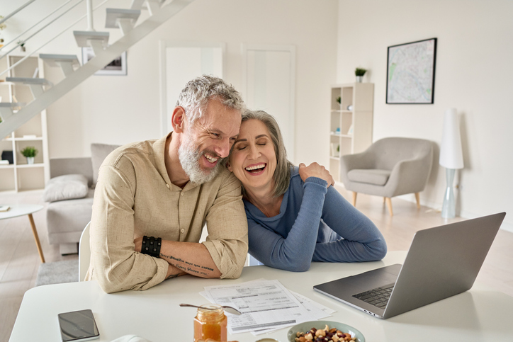 A couple reviewing their retirement savings goals.