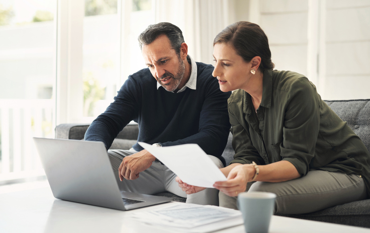 A couple reviewing tax strategies for their annuity. 