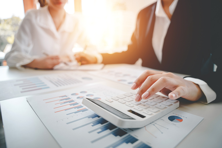 A financial advisor working with a client on creating a tax plan.