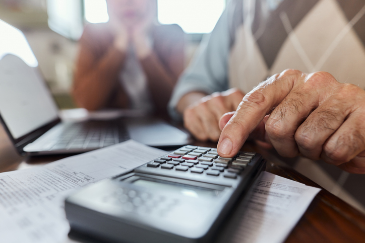 Closeup of a taxpayer reviewing his taxes.