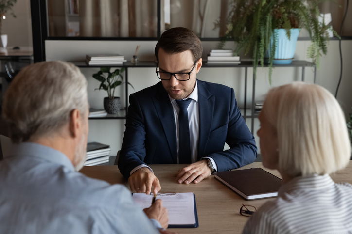 Clients meeting with a financial advisor to create a cross-border tax plan.