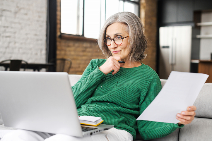 A woman near retirement reviewing her retirement savings plans.