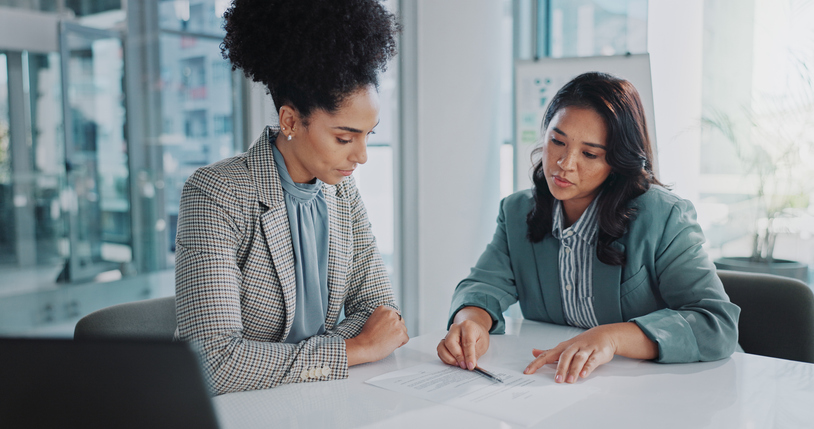 A financial advisor reviewing cross-border assets with an accountant.