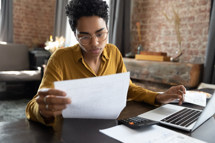 A woman reviewing her taxes.